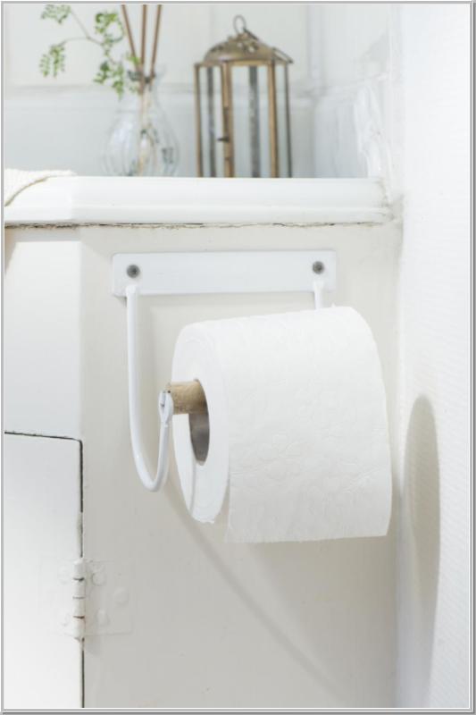Metal toilet roll holder with white wooden roll